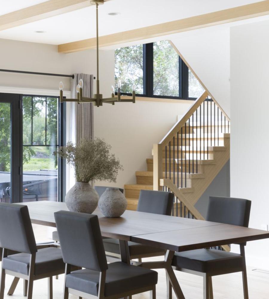 Dining room With faux beams and intentional design