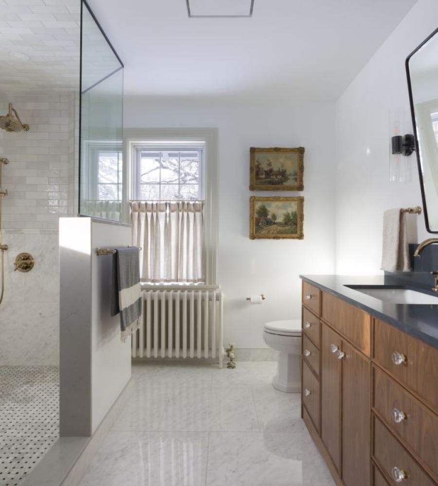 Custom bathroom with basketweave tile and rich cabinetry